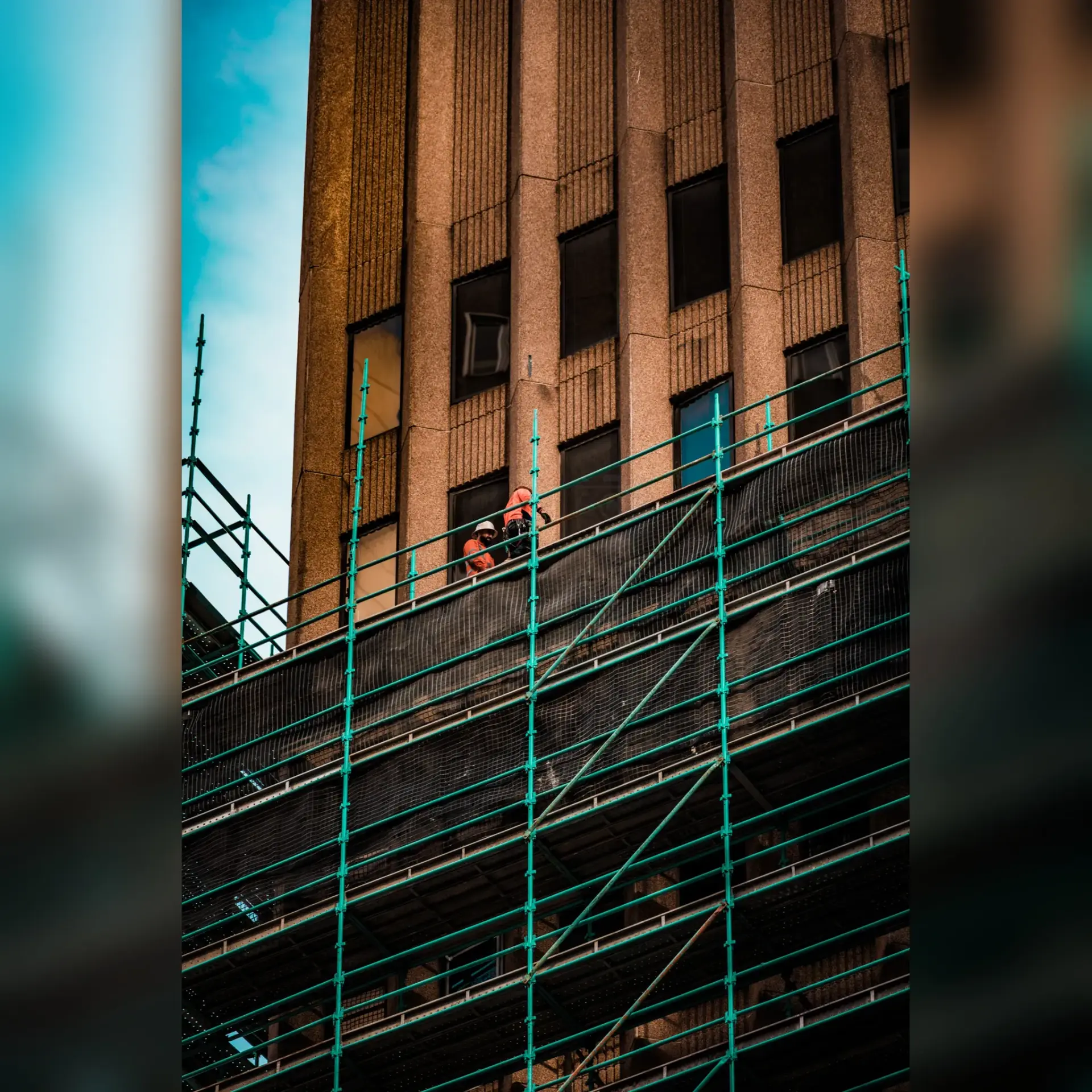 Reflection of skyscrapers in a glass office building exterior